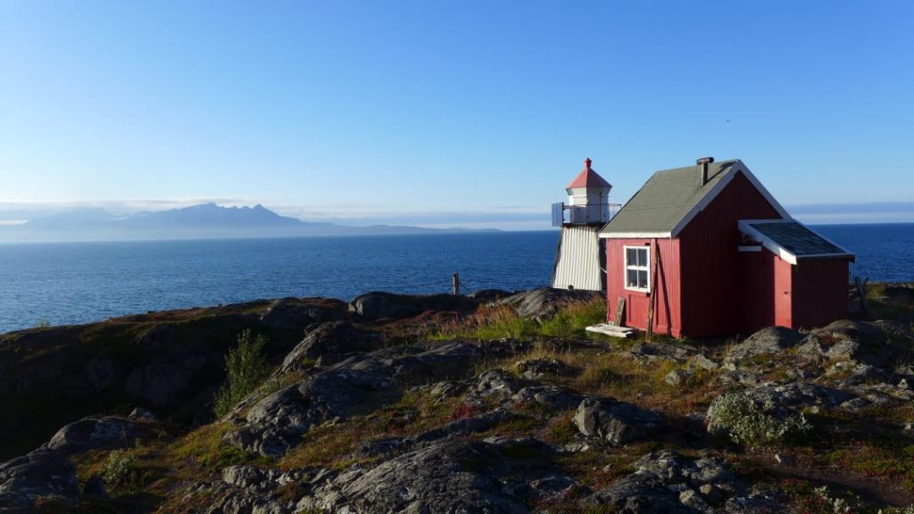 Hike the Lyngen Peninsula, lighthouse and red cabin, Norway