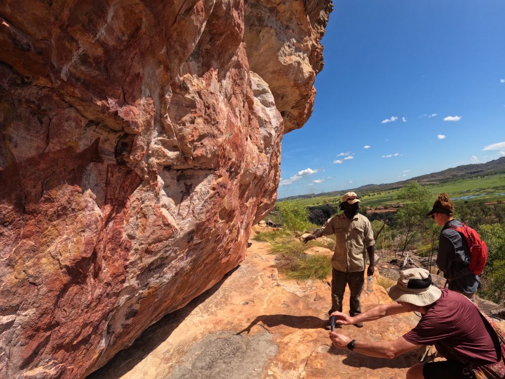 Rock art in Kakadu being shown by guides to tourists