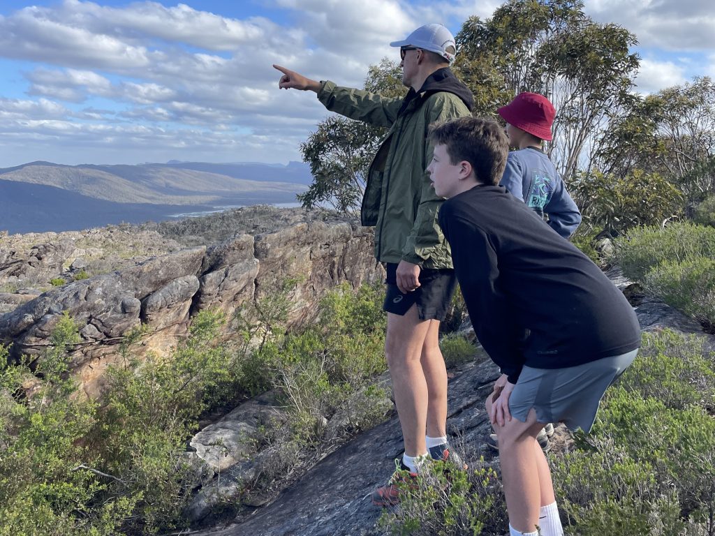 Boys and a father enjoying spectacular views of Gariwerd